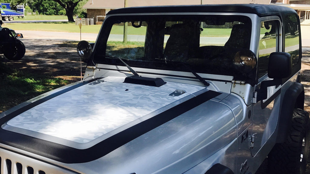 Hand-crafted carbon fiber and camo vinyl wrap