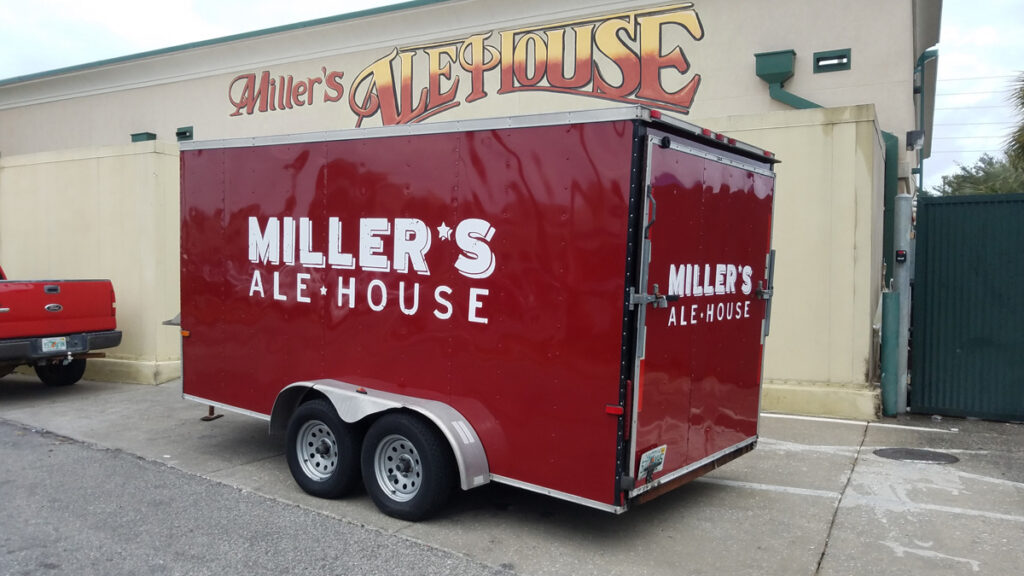 Red trailer with Miller's Ale House branding