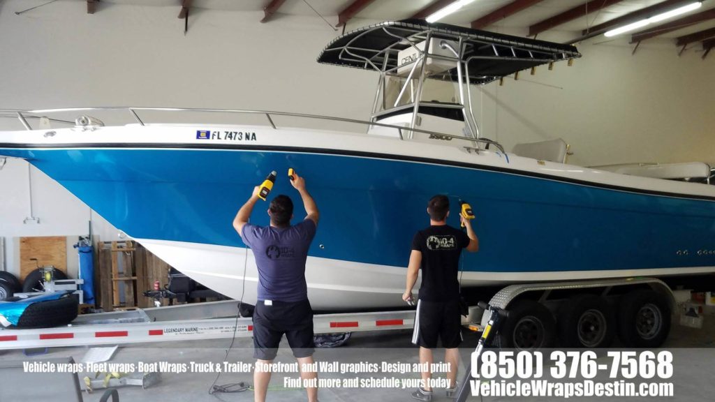Century boat color change wrap to metallic blue with carbon fiber accents