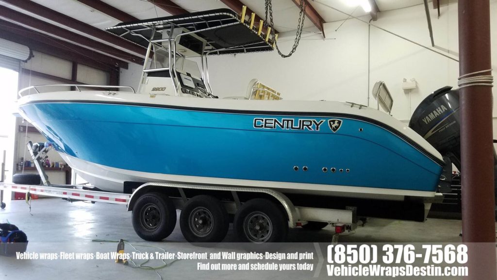 Chrome vinyl accent on blue wrapped Century boat