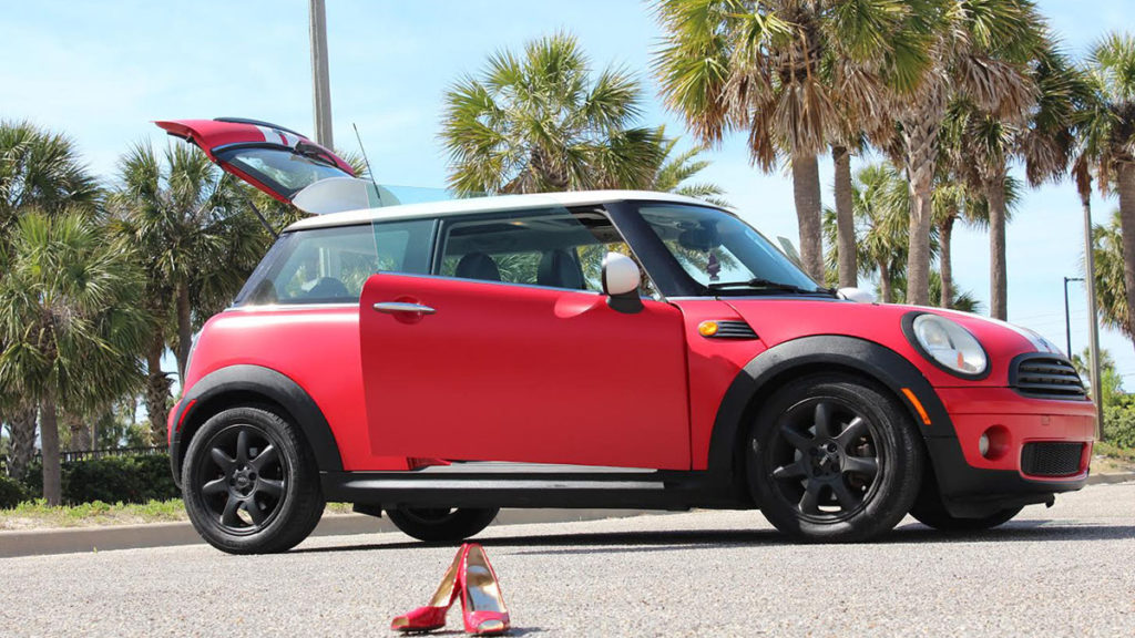 Side view of Satin Red Mini Cooper with custom wrap