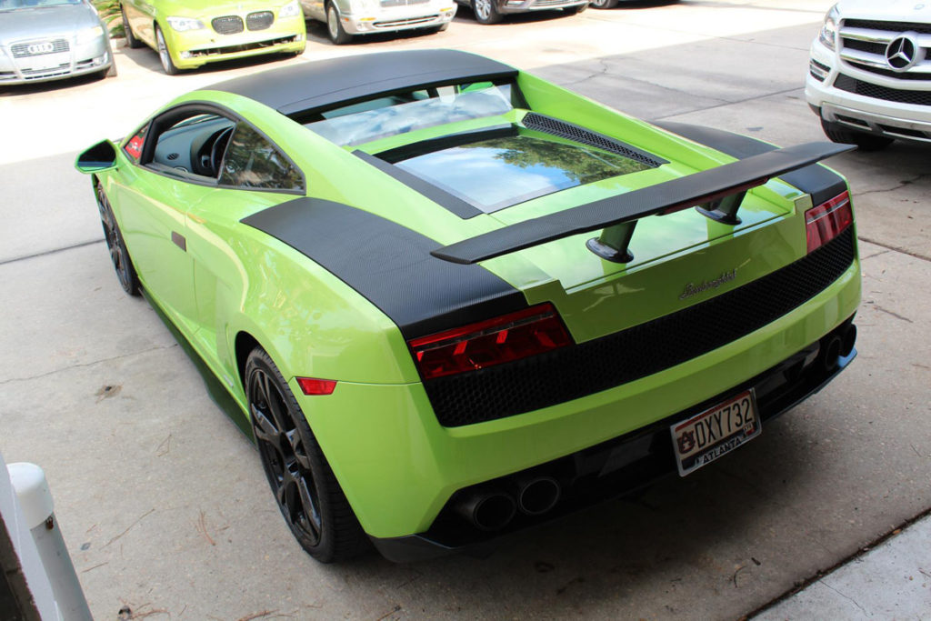 Embossed Lamborghini logo installed on wrapped hood