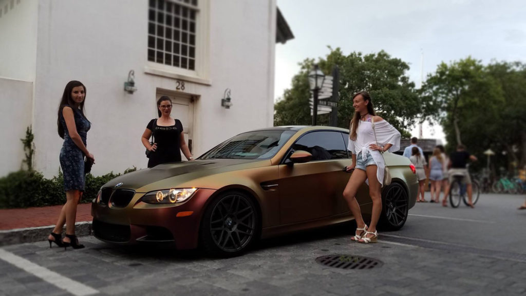 Vehicle wrap Destin experts installing colorshift vinyl on BMW M3